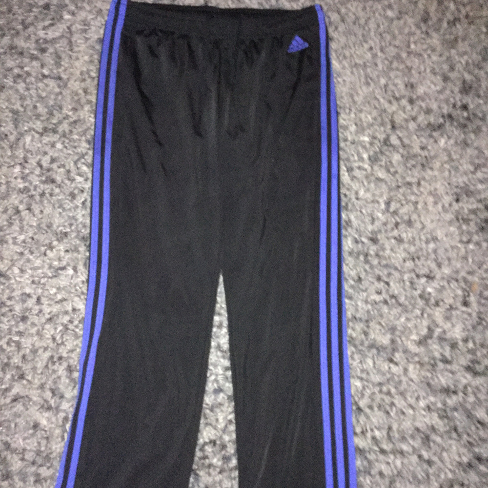 blue and black Adidas pants
